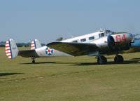 G-BKGL @ EGSU - Privately owned. Wears USAAF markings with serial 1164. - by vickersfour