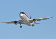 N124US @ KORD - US Airways A320-214, AWE1996, arriving KORD 27L from KPHL. - by Mark Kalfas