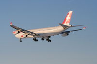 HB-JMJ @ KORD - Swissair A340-313, SWR84T, arriving KORD RWY28 KORD from LSZH (Zurich). - by Mark Kalfas
