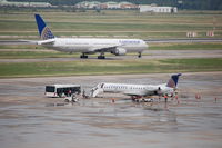 N17138 @ IAH - N17138 parked, unloading pax with a COA B764 in the back. - by AJ Heiser