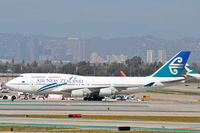 ZK-SUJ @ KLAX - Air New Zealand Boeing 747-4F6, getting a tow to the gate KLAX. - by Mark Kalfas