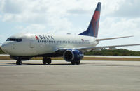 N305DQ @ TNCB - Taxiing into the parking position. First Delta 737-700 in Bonaire - by Gideon N. Williams