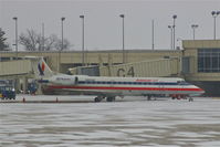 N855AE @ CID - Pulling out of the gate during light snow - by Glenn E. Chatfield