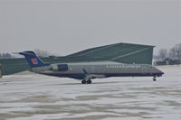 N506MJ @ CID - Moving into position for de-icing during light snow - by Glenn E. Chatfield