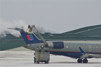 N506MJ @ CID - De-icing during light snow - by Glenn E. Chatfield