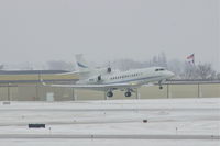 N12U @ CID - In the flare over the numbers on Runway 27 during snow shower - by Glenn E. Chatfield