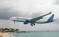 F-OFDF @ TNCM - Air Caraibes A330 over maho beach and landing at TNCM runway 10 - by Daniel Jef