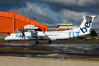 G-ECOK @ EGGW - Flybe Dash 8 taxies in at Luton - by Terry Fletcher