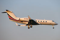 N448QS @ EGLL - Netjets Gulfstream 450 arrives in the fading light at Heathrow - by Terry Fletcher