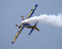 N580GP @ LFI - Showing off the opposing colors on her belly as the smoke rolls - by Paul Perry