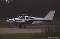 N30JM @ PVG - Sitting around at dusk - by Paul Perry