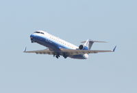 N971SW @ KLAX - SkyWest Bombardier CL-600-2B19, SKW6323 departing 25R for KSAN. - by Mark Kalfas