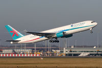 G-DBLA @ EGCC - Operating with Thomson but still in First Choice colours & with wing vapour trail. - by MikeP