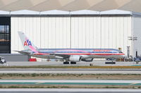 N664AA @ KLAX - American Airlines Boeing 757-223. N664AA, AAL581 arriving from KSTL waiting for it's gate at the AA maintenance hanger. - by Mark Kalfas