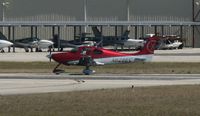N628EC @ KAPF - Departing runway 32 - by Kreg Anderson