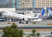 N39415 @ KLAX - Continental Airlines Boeing 737-924, COA16 to KEWR, departing 25R KLAX. - by Mark Kalfas