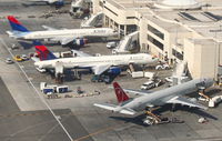 N645DL @ KLAX - Delta Airlines Boeing 757-232, N645DL (center) Terminal 5, Gate 55A KLAX. - by Mark Kalfas