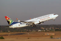 ZS-SJG @ FAJS - Boeing 737-8BG [32353] (South African Airways) Johannesburg~ZS 19/09/2006. Seen departing .Taken through the glass of the terminal. - by Ray Barber