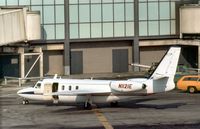 N1121E @ JFK - Jet Commander 1121 parked at the terminal at Kennedy in the Summer of 1977. - by Peter Nicholson