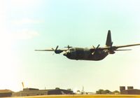 XV303 @ MHZ - Hercules C.3 of the Lyneham Transport Wing on a fly-past at the 1990 RAF Mildenhall Air Fete and acting as support aircraft for the RAF Falcons parachute display team. - by Peter Nicholson