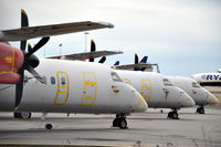 LN-RDA @ ESKN - SAS Commuter Dash 8 400s at Nyköping Skavsta airport in Sweden. These are LN-RDA (in front), LN-RDT and LN-RDP, which are in storage after being taken out of service by SAS after a series of main landing gear collapses. - by Henk van Capelle
