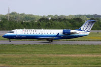 N37218 @ ORF - United Express (Mesa Airlines) N37218 (FLT ASH7270) taxiing to RWY 23 for departure to Washington Dulles Int'l (KIAD). - by Dean Heald