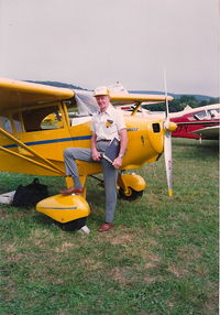 N4675H - Clyde Smith Piper test pilot at New Haven wiping his feet on 4675H - by L Walker