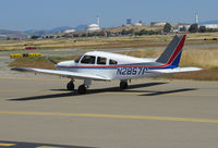 N2857P @ KCCR - 1979 Piper PA-28-181 taxying with oil tank farm in background - by Steve Nation