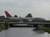 N537US @ EHAM - Crossing the canal after landing rw18R - by ghans