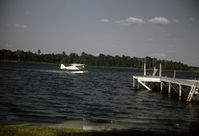 N42351 - Taking off from Lake Iola, Pasco County, Florida, 1968, pilot and owner Tom McCabe - by Charles H. Carey