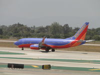 N233LV @ LAX - Starting take off roll on runway 24L - by Helicopterfriend