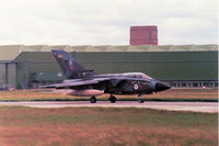 ZA409 @ EGQS - Tornado GR.1, callsign Magnum 3, of RAF Honington's Tactical Weapons Conversion Unit taxying to the active runway at RAF Lossiemouth in the Summer of 1991. - by Peter Nicholson