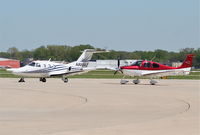 N800AZ @ KDPA - FFI Aircraft, Eclipse EA500 on the ramp KDPA with a size good comparison to the SR-22. - by Mark Kalfas