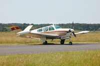 G-VTAL @ EGFP - Classic V-tail Bonanza visiting Pembrey Airport. Previously registered HB-EJB - by Roger Winser