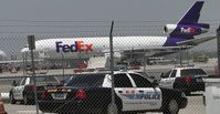 N392FE @ ONT - Parked behind Fed Ex Ontario, hidden by Airport Police Fence - by Helicopterfriend