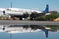 N555SQ @ PAFA - Everts Air Cargo DC6 - reflection - by Dietmar Schreiber - VAP