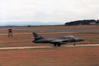 XF995 @ EGQS - Hunter T.8B of 12 Squadron awaiting clearance to join the active runway at RAF Lossiemouth in the Summer of 1988. - by Peter Nicholson