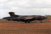 XV865 @ EGQS - Buccaneer S.2B of 208 Squadron awaiting clearance to join the active runway at RAF Lossiemouth in the Summer of 1988. - by Peter Nicholson