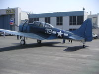 N670AM @ KHHR - Planes of Fame Douglas SBD-5 Dauntless, NX670AM on the ramp at KHHR during the 2004 Air Faire. - by Mark Kalfas
