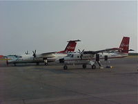 N886EA @ PANC - ERA Aviation N886EA Dehavilland DHC-6-300 next to N883EA Era Aviation Dash 8 at PANC. - by Mark Kalfas