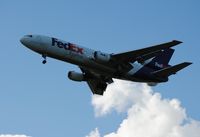 N569FE @ KLCK - Evening FedEx service on final - by Kevin Kuhn