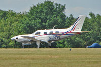 G-DTFL @ EGTB - Piper lands in the shimmering heat at AeroExpo 2010 - by Terry Fletcher