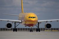 EI-OZB @ EDDP - Yellow bird arrives in noon sunlight at DHL-Hub LEJ - by Holger Zengler