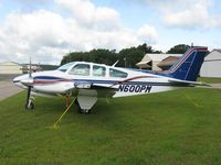 N600PM @ Y50 - Beech 55 Baron in the grass. - by Kreg Anderson