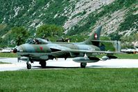 J-4105 @ LSMJ - This Hunter returns from one of the missions during WK93. Watch all those F-5's in the background. It is hardly imaginable how the Swiss AF housed over 25 aircraft in a cave..! - by Joop de Groot