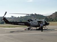 N510WW @ POC - Securing water holding bucket and hook in preparation to head back home from working the Crown fire - by Helicopterfriend