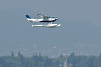 C-FTNI @ YVR - landing on a hot hazy day - by metricbolt