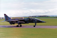 XX839 @ EGQS - Jaguar T.2A of 226 Operational Conversion Unit awaiting clearance to join the active runway at RAF Lossiemouth in May 1990. - by Peter Nicholson