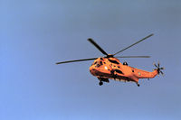 XZ598 @ EGQS - Sea King HAR.3 of 202 Squadron overflying RAF Lossiemouth in May 1990. - by Peter Nicholson