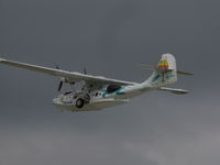 N222FT @ KOSH - Off into stormy skies at EAA2010 airshow - by steveowen